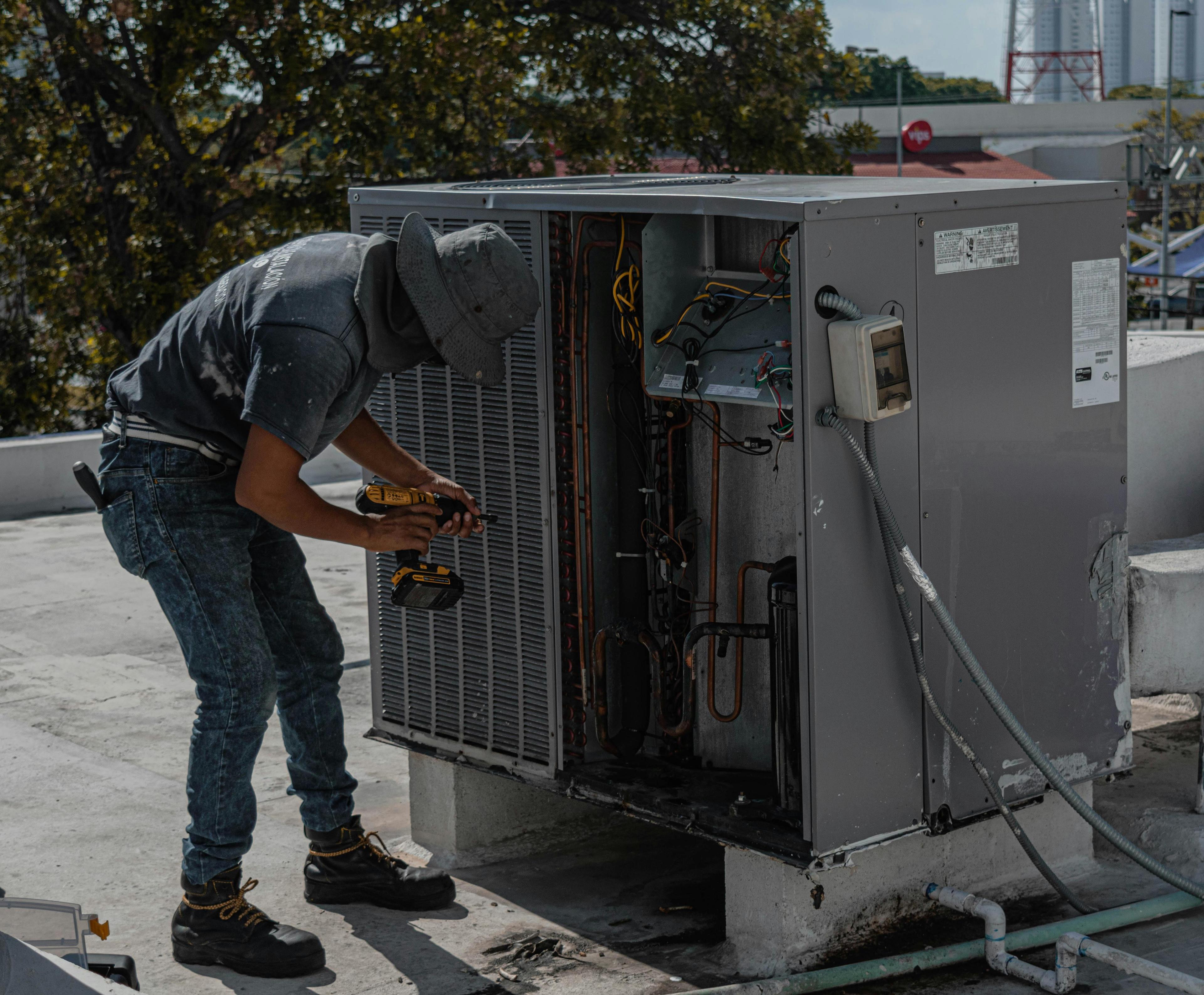 Outdoor AC unit surrounded by debris and high winds